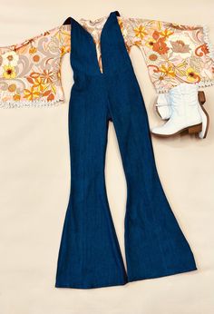 - Express Your Unique Vibe -  Get ready to groove in style with our Kids Denim Retro Style Jumpsuit! Made from soft and durable denim fabric, this jumpsuit is the perfect combination of comfort and style. Featuring a vintage print exaggerated bell sleeve top with trim detailing and bell bottoms, this jumpsuit is available in light and dark wash denim options. Whether your child prefers the classic blue of light wash denim or the edgy look of dark wash denim, we've got you covered! Our Kids Denim Retro Style Jumpsuit is available in a range of sizes to fit children of all ages and body types. The playful design and comfortable fit make it a must-have for any fashion-conscious child who loves to have fun and express their individuality. So, whether your child is headed to a party or just pla Retro Fitted Denim Jumpsuit Overall, Retro Fitted Overall Bottoms, Retro Fitted Overalls, Fitted Overall Pants For Fall, Fitted Overalls For Fall, Fitted Fall Overalls Pants, Fitted Blue Denim Retro Jumpsuit, Blue Fitted Vintage Denim Jumpsuit, Retro Fitted Medium Wash Jumpsuits And Rompers