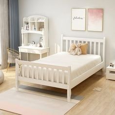 a bedroom with white furniture and wooden floors