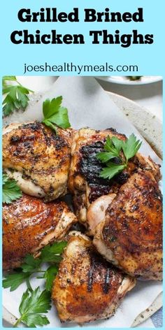 grilled chicken thighs on a plate with parsley