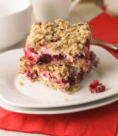 two dessert bars stacked on top of each other with crumbs and toppings