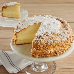 a cake sitting on top of a white plate next to a slice cut out of it