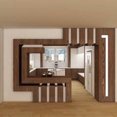 the interior of a modern kitchen with wood accents on the walls and wooden flooring