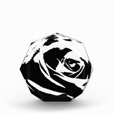 a black and white image of a rose on a paperweight with the word love written in it