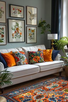 a living room filled with furniture and pictures on the wall above it's windows