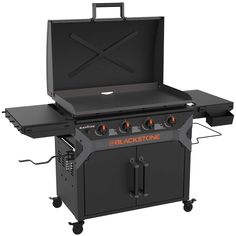 the blackstone bbq is shown with its lid open and two burners on it