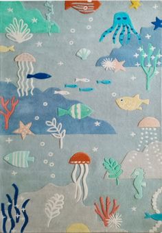 an area rug with sea animals and fish on it