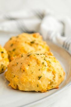 two biscuits on a plate with a napkin in the background