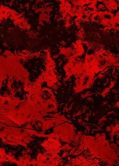 an abstract red background with black spots