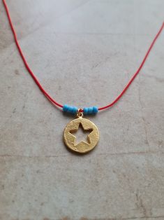 🌙 Handcrafted 14k gold plated dainty adjustable red string necklace 🌙 All materials used are tarnish free and durable 🌙 Best gift for your friends and family or just for yourself 🌙 Regular shipping takes approximately 10-15 business days depending on your country. Express shipping takes 3-5 business days. Please choose express shipping if you want to receive your package faster 🌙 I do offer combined shipping. Please feel free to contact me for custom orders and combined shipping orders 🌙 Although my products are durable and tarnish free, you better keep them away from excessive water and chemicals, perfumes etc. 🌙 For more jewelries don't forget to check my store: https://www.etsy.com/shop/MiniMoonDesign Handmade Adjustable Yellow Gold Charm Necklaces, Adjustable Star Charm Festival Jewelry, Adjustable Star Charm Jewelry For Festivals, Red Necklace With Star Charm For Gift, Red Necklace With Star Charm As Gift, Adjustable Charm Necklaces With Tiny Beads As Gift, Adjustable Gold Charm Necklace With Tiny Beads, Handmade Dainty Adjustable Charm Necklaces, Dainty Handmade Adjustable Charm Necklaces