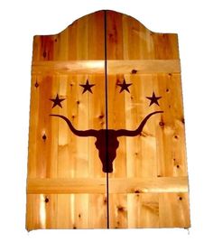 two wooden doors with longhorns and stars on them