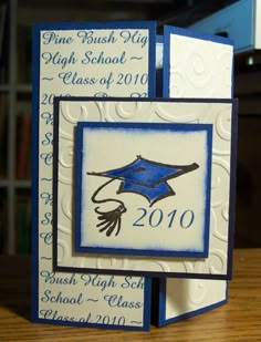 two graduation cards with blue and white designs