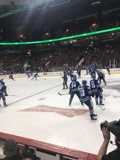 an ice hockey game is being played at the arena