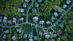 an aerial view of houses and roads in the suburbs