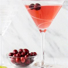 two glasses filled with cranberry martinis and cherries