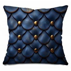 a blue pillow with gold studding on it's sides and an intricate design