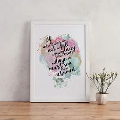 a watercolor painting with a quote on it next to a potted plant