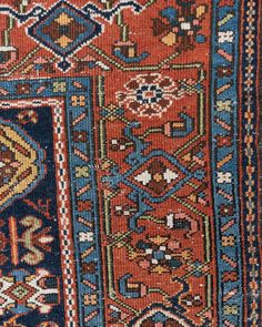 an old rug with many different colors and patterns