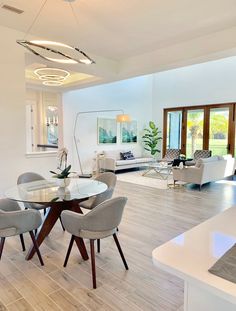 a dining room table and chairs in a living room