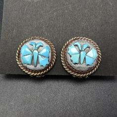 "VINTAGE BUTTERFLY TURQUOISE INLAY on MOTHER of PEARL EARRINGS DESCRIPTION: These exquisite earrings are made by artisans using sterling silver and genuine gemstones. The clip-on mechanisms are tight and secure. These elegant earrings will be a cherished addition to your collection of quality vintage Southwestern and Native American jewelry. MEASUREMENTS: Earrings measure 5/8\" across WEIGHT: 5.1 grams SIGNED: no STERLING: unmarked, verified sterling silver" Handmade Vintage Sterling Silver Earrings, Vintage Sterling Silver Round Earrings, Vintage Sterling Silver Earrings Stamped 925, Handmade Vintage Sterling Silver Clip-on Earrings, Vintage Sterling Silver Round Clip-on Earrings, Silver Inlay Round Earrings, Traditional Silver Earrings With Inlay, Silver Inlay Earrings, Unique Silver Earrings With Inlay