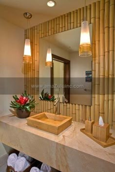 a bathroom with two sinks and mirrors in front of bamboo wall coverings on the walls