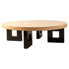 an oval table with two black square bases