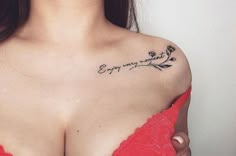 a woman's chest with a tattoo saying enjoy every moment on her left side