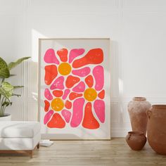 an art print is displayed on the wall next to two vases and a chair