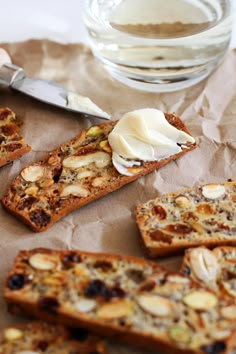 slices of bread with nuts and cream on top