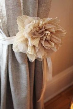 a curtain with a flower attached to it