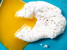 a blue plate topped with whipped cream and an egg