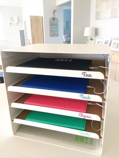 an open drawer with five different colored folders in it and the words fun on them