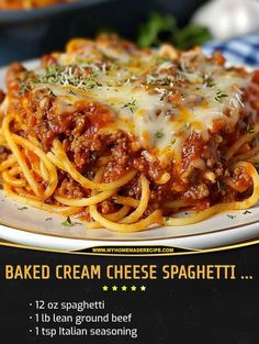 a close up of a plate of food with spaghetti and cheese on it in front of a menu