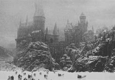 an old black and white photo of a castle in the snow