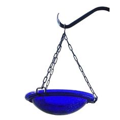 a blue glass bowl hanging from a chain