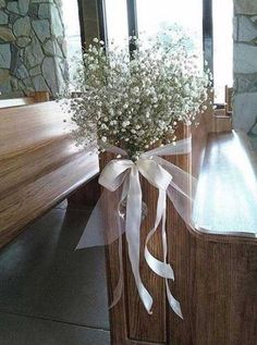 a bouquet of flowers sitting on top of a wooden bench