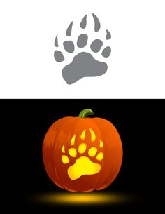 an orange pumpkin with paw prints on the front and side, next to a black background