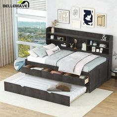 a bed with two drawers underneath it in a room