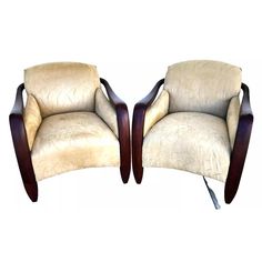 pair of art deco style chairs with curved arms