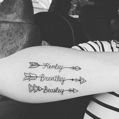 a woman with a tattoo on her arm that says family, brandy and beausey