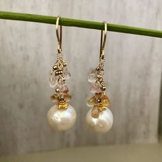 Gorgeous freshwater Pearl Drop Earrings. They are perfect in their simplicity and are incredibly elegant. There is a great deal of detail in these earrings, as you would expect from a Praha Jewelry Design piece. Description: 15mm white round pearls are suspended by 14K GF chain with pastel sapphire briollets. 2mm 14K GF seamless balls sit just above each briollet. All 14K GF and 24K vermeil components Pearl White Akoya Pearl Drop Earrings, Pearl White Akoya Pearl Teardrop Earrings, Briolette High Luster Pearl Earrings As Gift, Briolette High Luster Pearl Earrings For Gift, Elegant Briolette Pearl Earrings, High Luster Briolette Pearl Earrings As Gift, High Luster Briolette Pearl Earrings For Gift, Anniversary Pearl Drop Earrings, Akoya Pearl Dangle Earrings For Pierced Ears