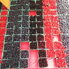 berries and raspberries for sale at a market