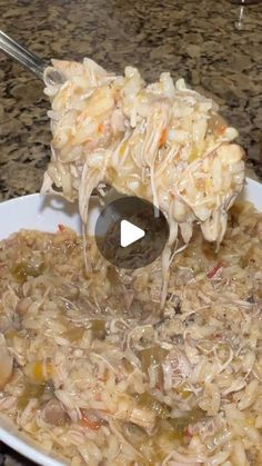 a white bowl filled with food on top of a counter