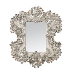 a decorative mirror with flowers on it