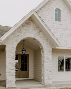 Home House Exterior, White Home Exterior With Stone, French Styled Home, Brick Archway Exterior, House Siding Ideas Exterior With Brick, Brick And Stone Exterior Combinations Farmhouse, Stone Pillars Porch Front Entry, Outdoor Exterior Design, Modern House White Windows