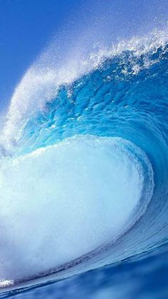 a man riding a wave on top of a surfboard