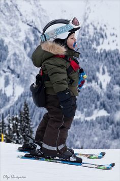 a young child on skis in the snow