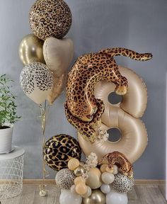 leopard print balloon decorations and balloons in the shape of numbers