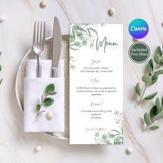 a place setting with silverware, napkins and green leaves on the plate next to it