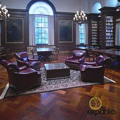 the library is full of leather chairs and tables