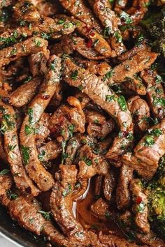 beef and broccoli stir fry in a skillet with sauce on the side